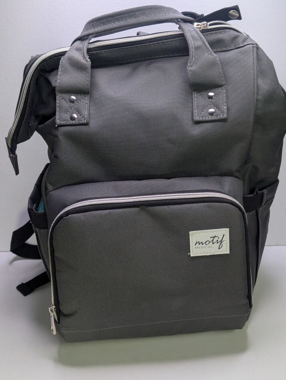 Motif Medical Breast Pump Backpack Diaper Bag GrayTeal Interior with 2 Spectra
